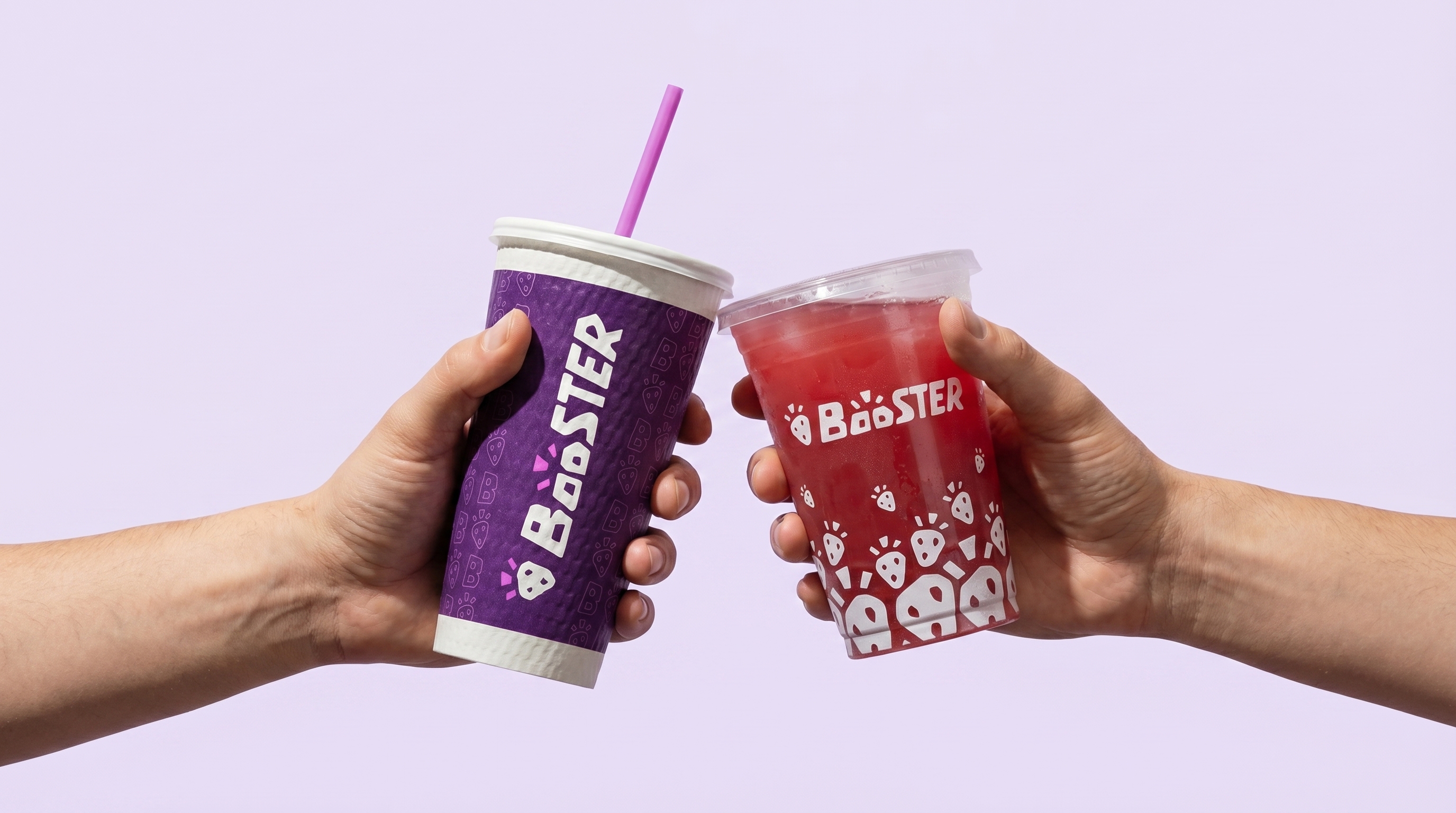 Two Booster drinks held together in a bright everyday moment